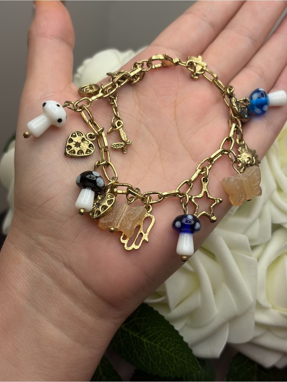 Gold-Tone Charm Bracelet with Blue & White Mushroom and Beige Butterfly Charms